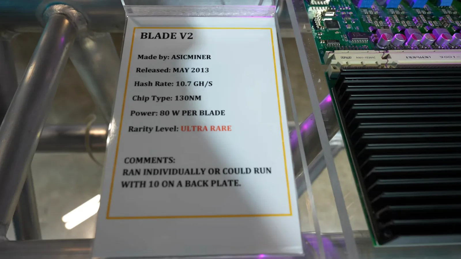 ASICMINER Blade V2 placard listing 10.7 GH per blade at 80 watts, ten blades stacked on one back plate ASICMINER Blade V2 placard listing 10.7 GH per blade at 80 watts, ten blades stacked on one back plate