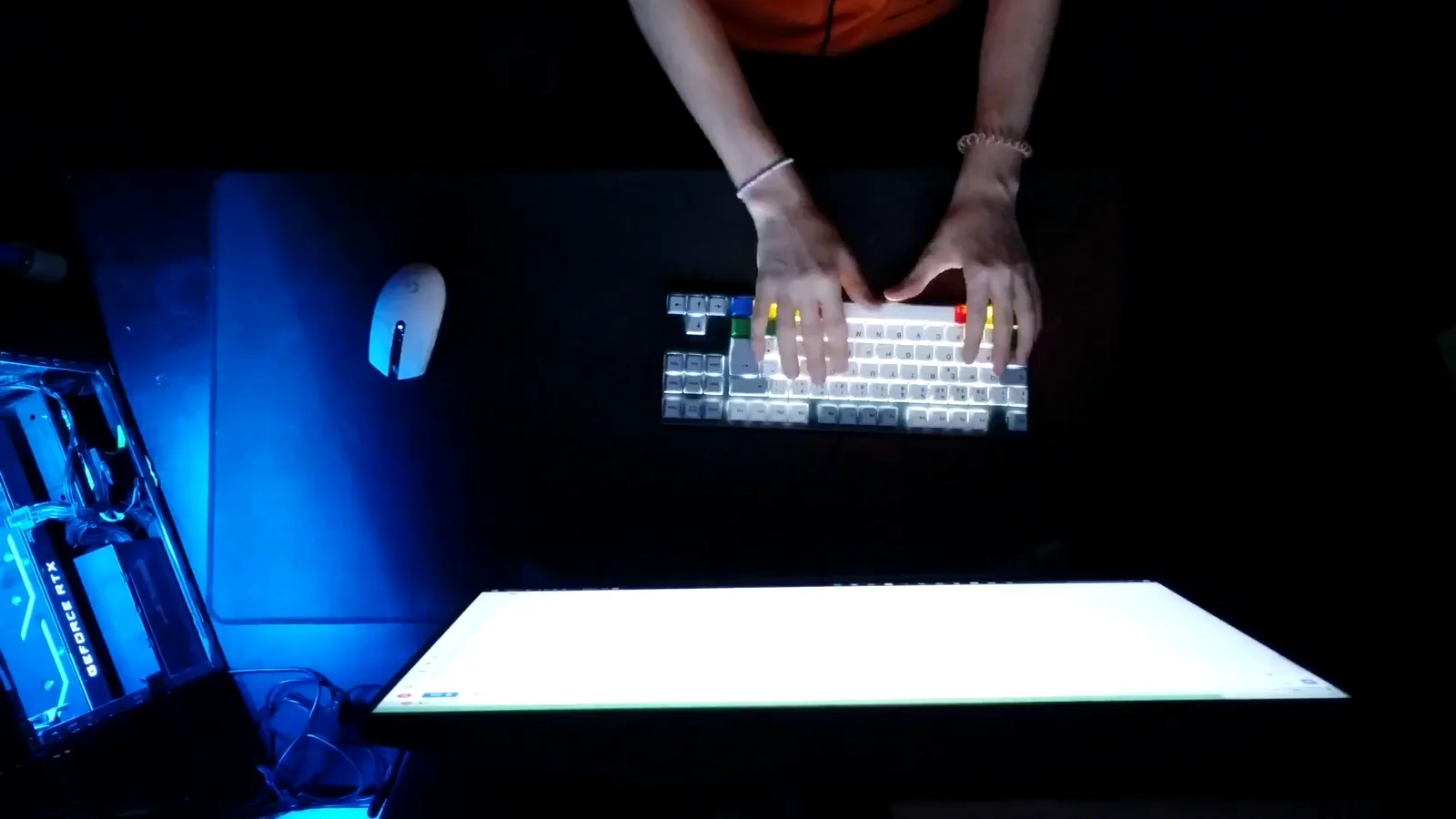 A backlit keyboard glowing in a dark blue-lit room with hands at the keys, the picture of an intruder at work during 2018's exchange hacks A backlit keyboard glowing in a dark blue-lit room with hands at the keys, the picture of an intruder at work during 2018's exchange hacks