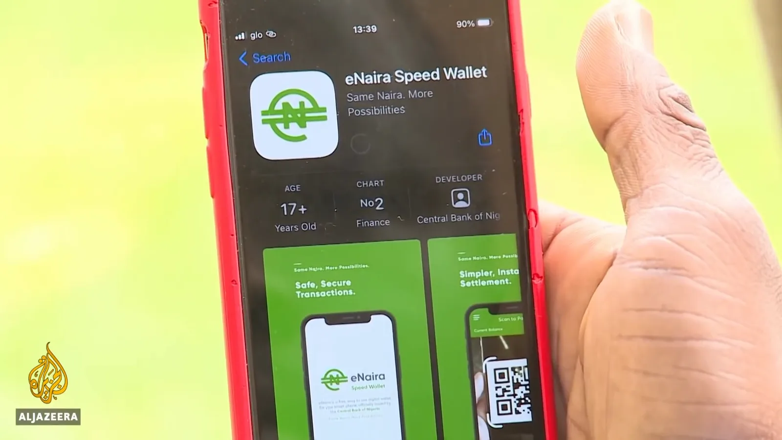 eNaira Speed Wallet listing on the Google Play store shown on a phone screen during Al Jazeera's launch-day coverage