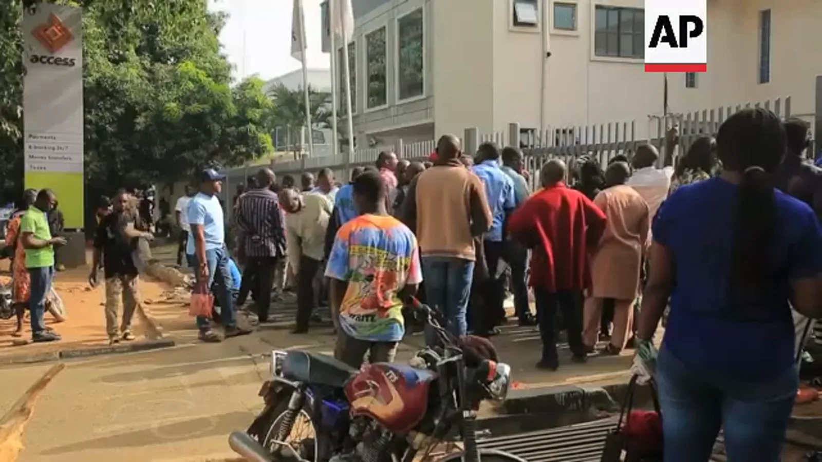 Long queue of customers waiting outside an Access Bank branch during Nigeria's February 2023 naira cash shortage